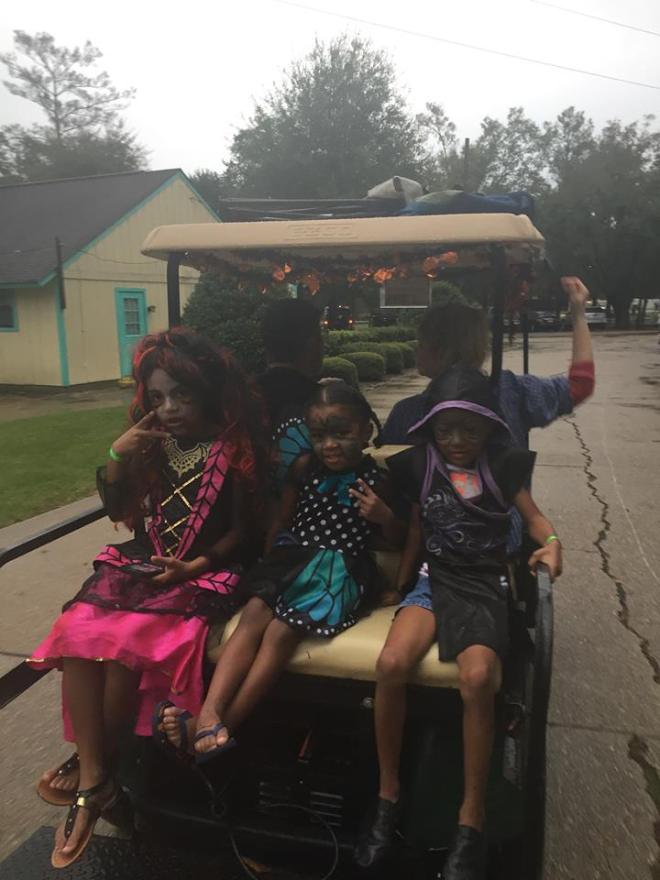 Riding to the trick-or-treat Halloween party.